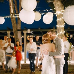 Groom kisses bride after the dance to the applause of the guests. High quality photo